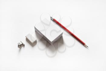 Blank stationery set on paper background. Business cards, pencil and eraser.