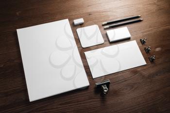Blank corporate stationery for branding design. Corporate identity set on wooden background.