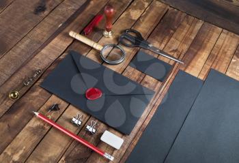 Vintage black blank stationery elements on wooden table. Branding template. Mock up for your design.