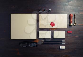 Corporate identity template. Blank corporate stationery set on wood table background. Flat lay.