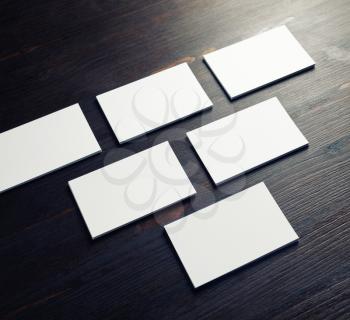Blank business cards on wooden background. Corporate stationery.