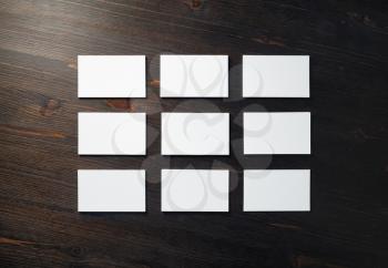 Blank business cards mock-up on wooden background. Template for branding identity. Flat lay.