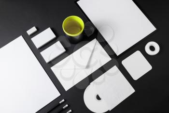 Blank stationery set on black paper background. Corporate ID mockup. Mock up for branding identity. Responsive design template.