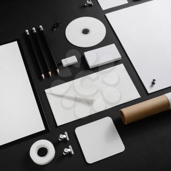Set of blank stationery elements on black paper background. Branding template. Mock-up for your design.