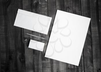 Photo of blank stationery set on wooden table background. Template for branding identity. Top view.