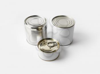 Three blank food tin cans. Template for placing your design.