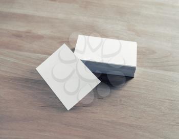 Blank business cards on wooden background. Template for branding identity.