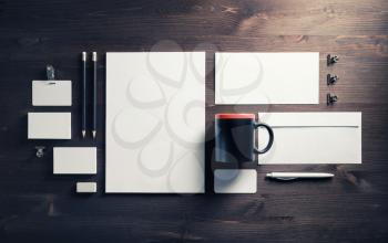 Blank stationery and corporate identity template on wood background. Responsive design mockup. Top view. Flat lay.