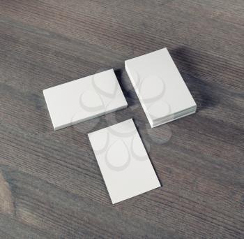 Blank business cards on wooden background. Mockup for branding identity.