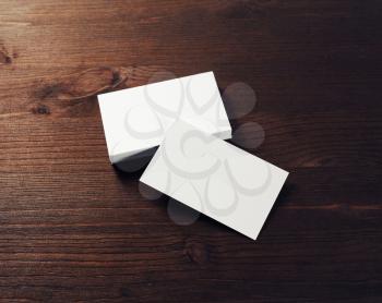 Blank white business cards on wooden table. Template for ID.
