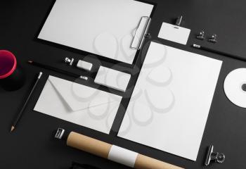 Photo of blank stationery set on black paper background. Corporate ID mock up for placing your design.