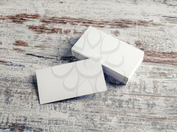 Blank white business cards on vintage wood background. Template for design portfolios. Responsive design mock up.