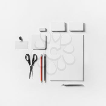 Corporate identity template. Photo of blank stationery set on white paper background. Mockup for design presentations and portfolios. Flat lay.