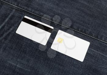 Blank bank cards on denim background. Credit cards. Front and back view.