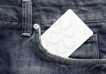 Photo of blank white bank card in jeans pocket. White credit card.