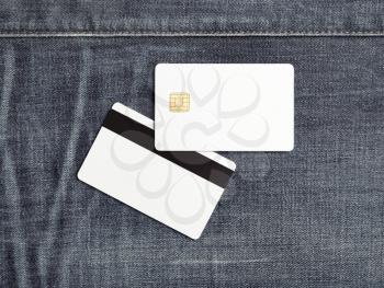 Bank cards mock-up. Blank white plastic credit cards on denim background. Front and back view. Copy space for text. Flat lay.