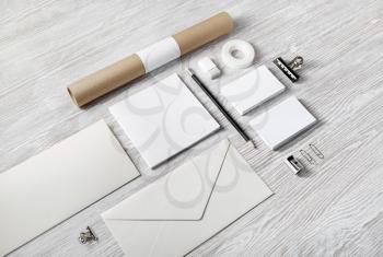 Blank corporate stationery set on light wood table background. Branding mock up.