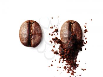 Grinding coffee bean. Roasted coffee bean and ground coffee isolated on white background. Flat lay.