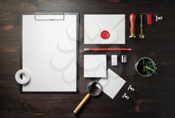 Blank corporate stationery set on wooden background. Template for branding design. Top view. Flat lay.