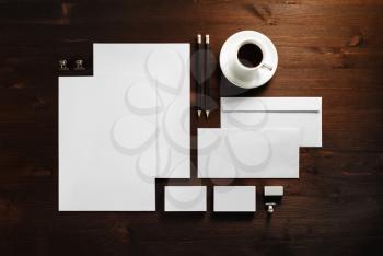 Blank corporate stationery set on wooden background. Template for branding identity. Flat lay.
