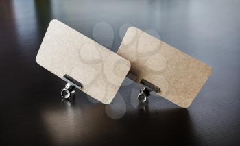 Photo of two blank kraft business cards. Branding ID template.