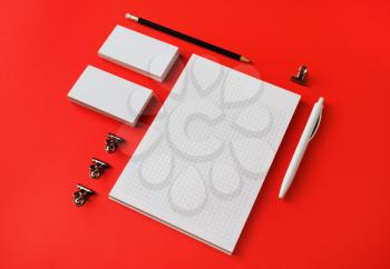 Blank white stationery set. Business brand template on red paper background.