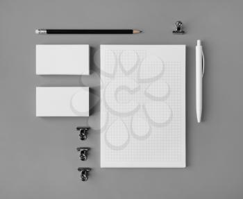 Blank corporate stationery set on gray paper background. Branding mock up. Flat lay.