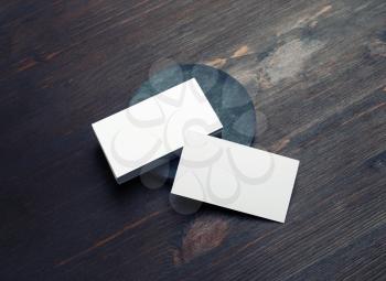 Photo of blank business cards on wooden background. Template for ID.