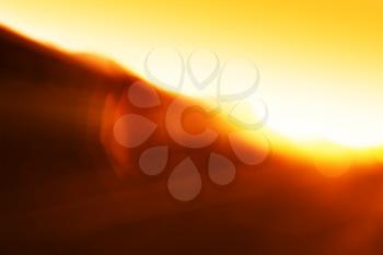 Horizontal burning sunset light leak bokeh background