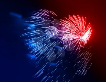 Dramatic red and blue fireworks at night sky background
