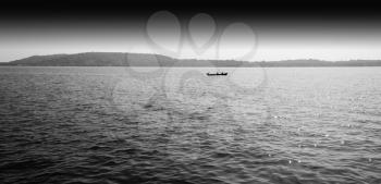 Horizontal black and white boat in ocean horizon landscape background backdrop