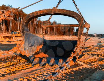 Horizontal vivid sand mining industrial scoop background backdrop