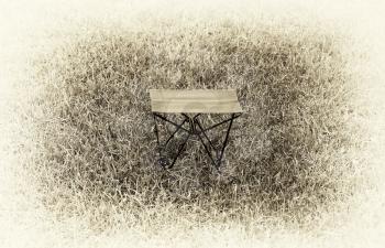 Horizontal vintage sepia travel chair vignette background