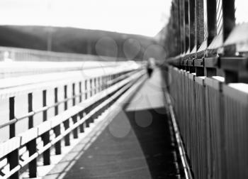 Black and white walking man on Norway bridge background hd