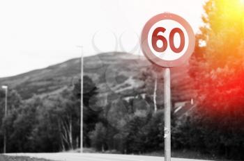 60 speed limit road sign with light leak background hd