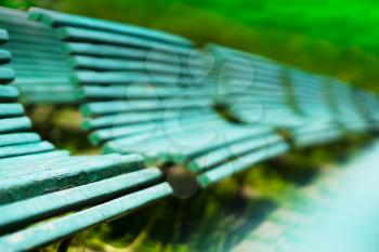 Diagonal park benches bokeh background hd