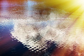 Dramatic light leak on water surface background hd