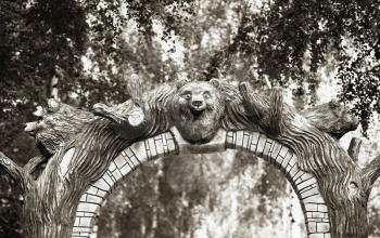 Sepia park gate with bear head background hd