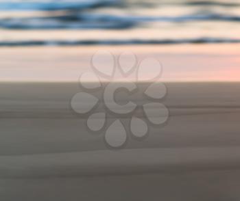 Horizontal pale smooth sand beach bokeh blur background backdrop