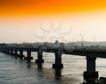 Horizontal vivid orange sunset indian bridge background backdrop