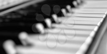 Diagonal black and white piano keyboard abstraction backdrop