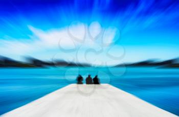 Horizontal vivid three freinds sitting on the quay motion blur abstraction background backdrop