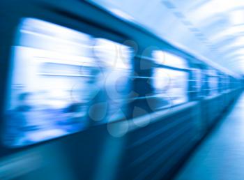 Diagonal blue metro train in motion abstraction background