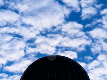 Dramatic ufo sphere globe on blue sky background