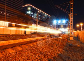 Night light trails on railroad track background