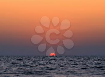 Boat in ocean during epic sunset background hd
