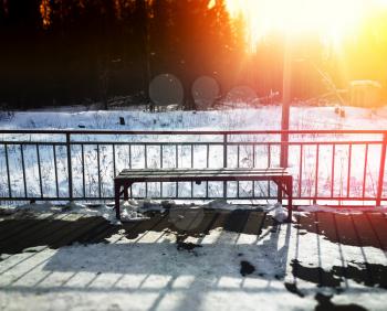 Railroad station bench with dramatic light leak background hd