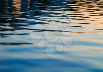 Sunset and smooth river surface background