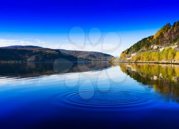 Horizontal vivid Norway day river water circles drops background backdrop