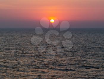 Horizontal vivid vibrant dramatic sunset in Indian ocean background backdrop